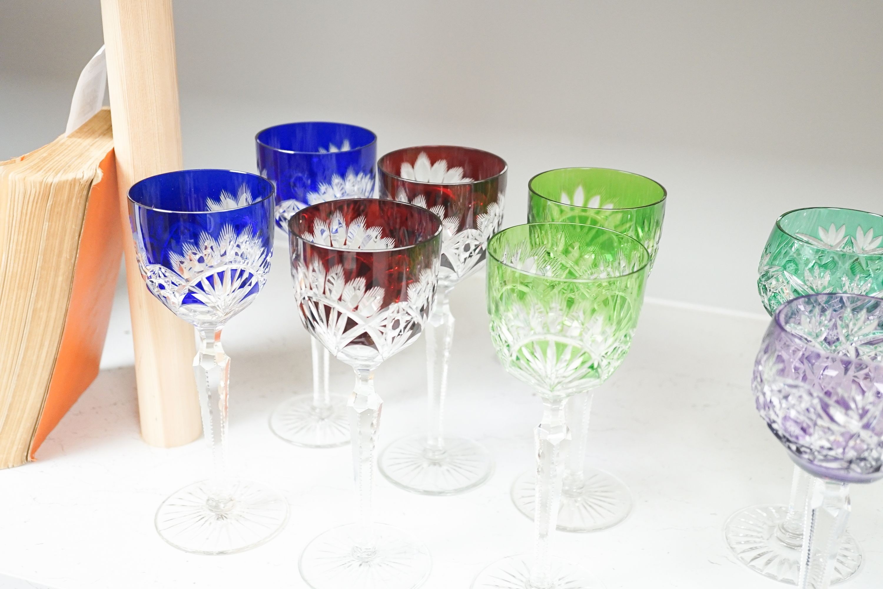 Two harlequin sets of six cut and colour flashed Hock glasses, tallest 21 cm(12)